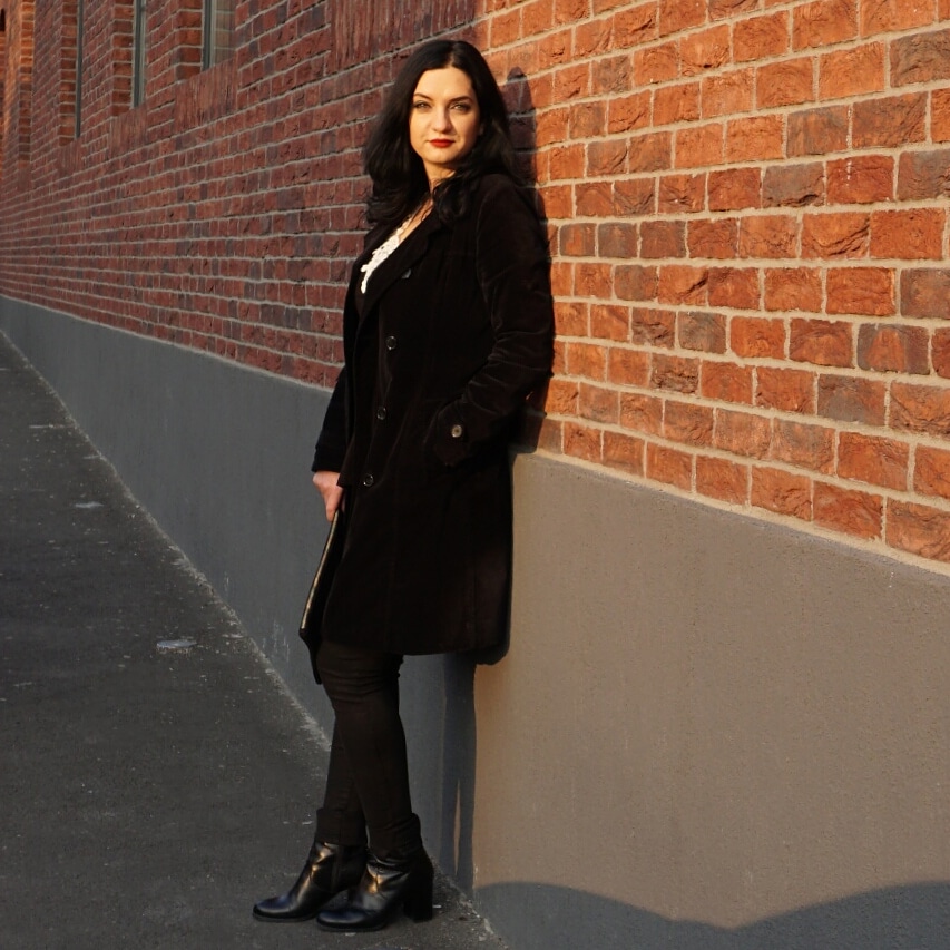 Woman wearing velvet trench coat